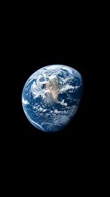 Earth viewed from space with North America sunlit clearly.