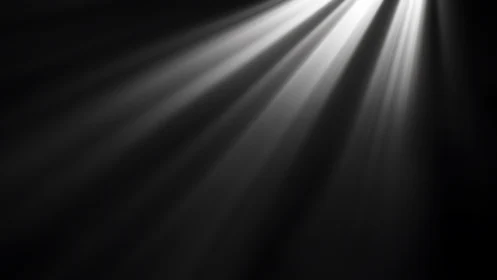Radiant diagonal light beams cutting through darkness.