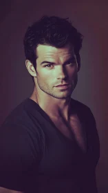 Moody portrait of a confident man in dramatic lighting.