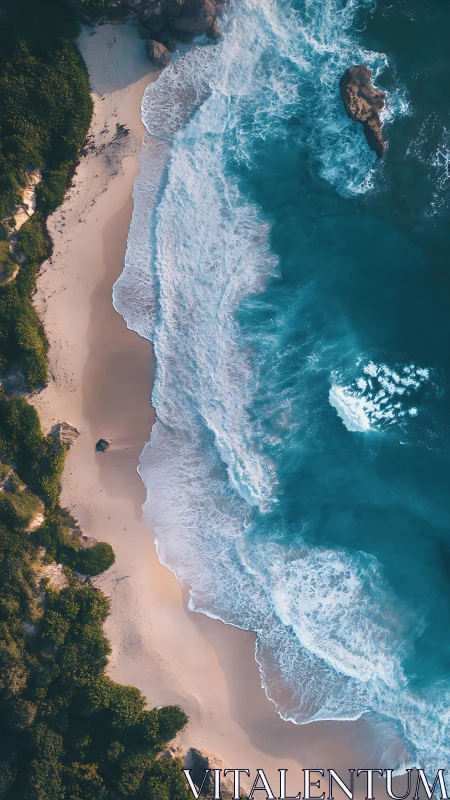 Aerial shoreline captures turquoise surf and golden sand.