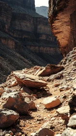 Eroded canyon ledge reveals stratified sandstone under harsh light