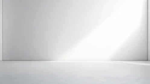 Minimalist white gallery wall with angled daylight beam.