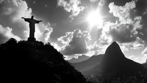Christ statue silhouette over Rio skyline at blazing sunset.