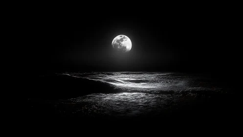 Full moon casts silvery light across dark ocean waves.