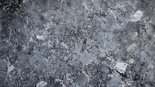 Weathered concrete surface shows flaking, spalled and pitted layers