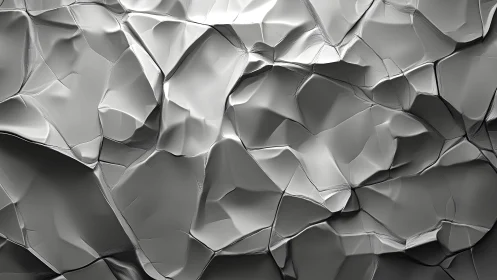 Abstract geometric silver metallic surface with polygonal folds.