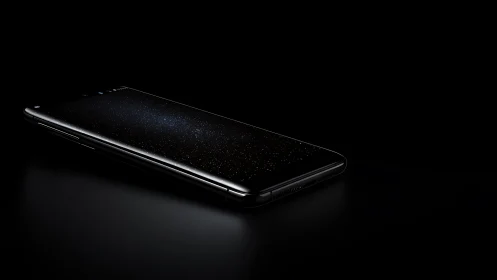 Smartphone lies on dark surface with screen showing star field