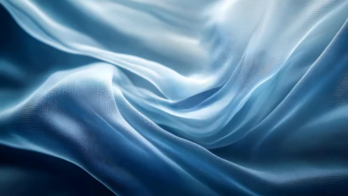 Flowing Blue Silk Fabric Abstract Background in Soft Light.