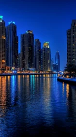 High-rise waterfront skyline at blue hour with reflections.