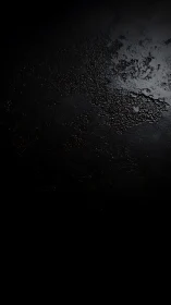 Dark textured surface displays partial reflective roughness