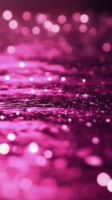 Defocused magenta light reflections form an abstract surface