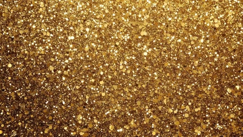 Radiant gold glitter surface with dense sparkling bokeh.