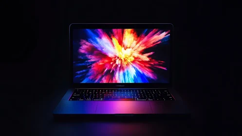 Photorealistic laptop with neon spectrum display explosion.