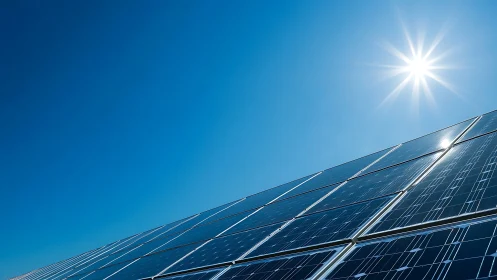 Angled solar panel array under intense midday sun flare
