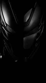 Glossy black futuristic helmet in low key lighting focus.