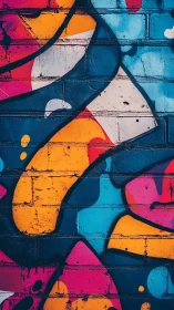 Vibrant geometric graffiti curves on textured brick wall.