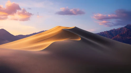 Sunlit desert dune crest under soft pastel dusk sky.