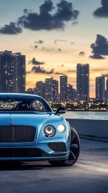 Luxury coupe commands a glowing city waterfront at dusk