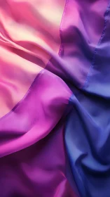 Gradient-dyed synthetic fabric surface shows folded color transitions