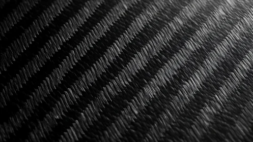 Close-up macro view of black textured diagonal surface pattern.