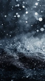 Dark granular surface with drifting light particles.