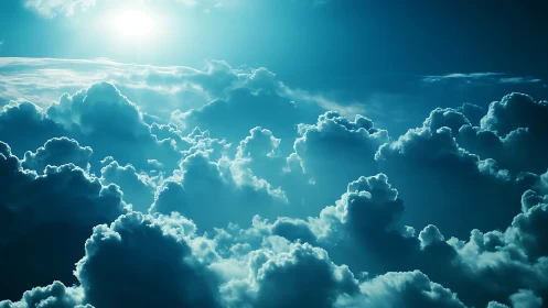 Sunlit cumulonimbus cloudscape in dramatic cyan atmosphere.