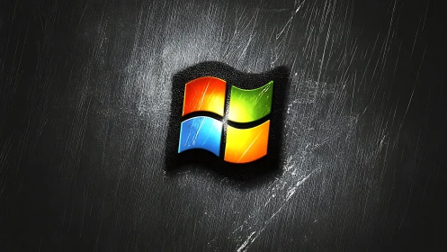 Colorful window logo glowing on a textured dark wall.