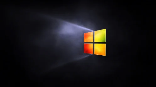 Glowing colorful window logo shining through soft darkness.