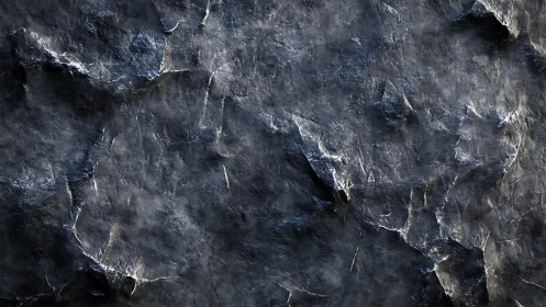 Dark textured stone surface with rugged cracked details.