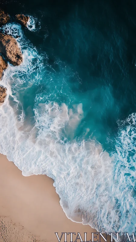 Aerial shoreline study contrasts cyan surf with sand