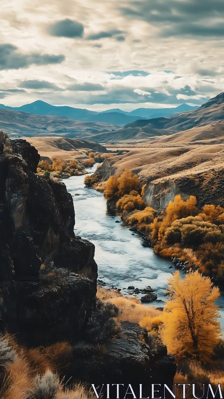 River cutting through autumn valley with distant blue hills.
