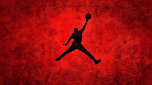 Silhouetted basketball dunker soars against vivid red sky.