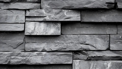 Stoic slate wall in layered grayscale geometry rhythm.
