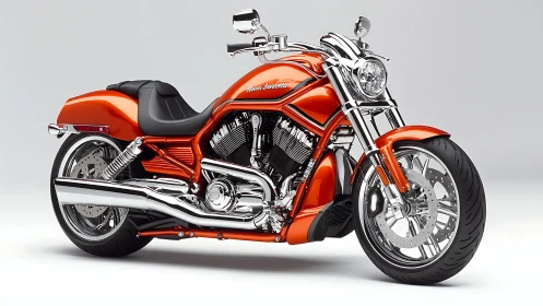 Orange chrome cruiser motorcycle on clean studio background.