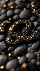 Black luxury ampersand with gold glitter on pebbled leather.