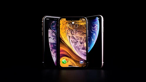 Smartphones with curved displays against black background.