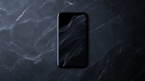 Black smartphone on dark marble surface, centered vertically.