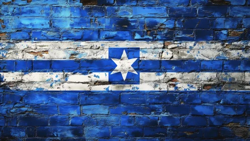 Weathered blue flag mural on distressed brick wall surface.