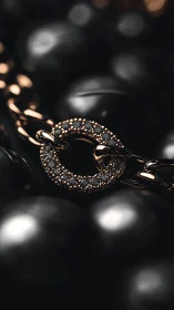 Close-up of gold diamond ring on dark beaded background.