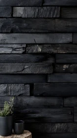 Charred timber wall whispers softly around quiet green
