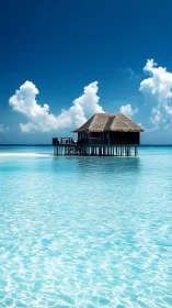 Solitary overwater bungalow on clear turquoise lagoon.