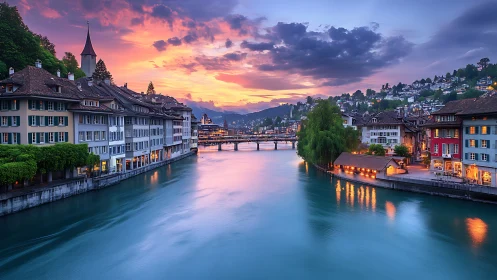 Riverside European old town under vivid sunset sky glow.