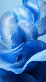 Undulating blue ribbons in ethereal abstract bloom form.