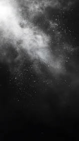 Monochrome cosmic dust cloud with dispersed starfield texture.