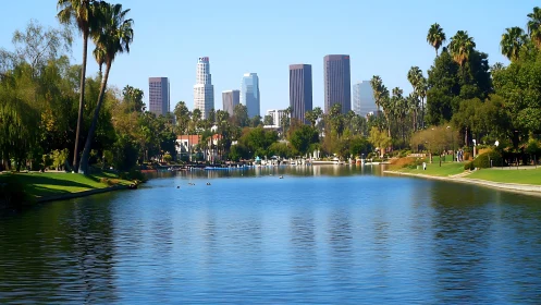 Downtown skyline rises beyond tranquil city park lake