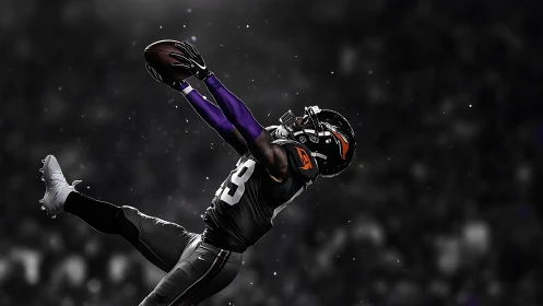 Leaping wide receiver extends for spectacular deep catch.