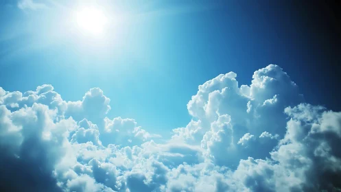 Sunlit cumulus clouds glow softly in a radiant blue sky