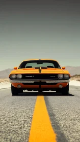 Front view of orange muscle car on empty desert highway.