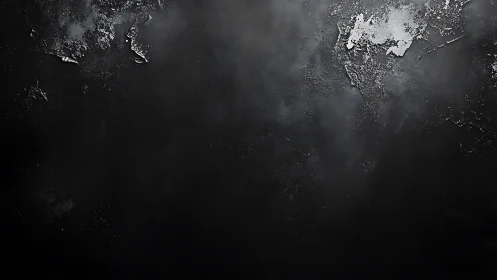 Textured black concrete wall with distressed metallic patches.