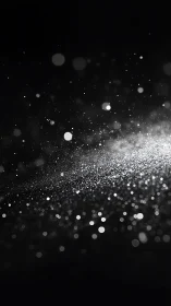 Silver light particles drift across dark black background.